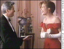 Julia Roberts laughs after Richard Gere surprises her during filming.